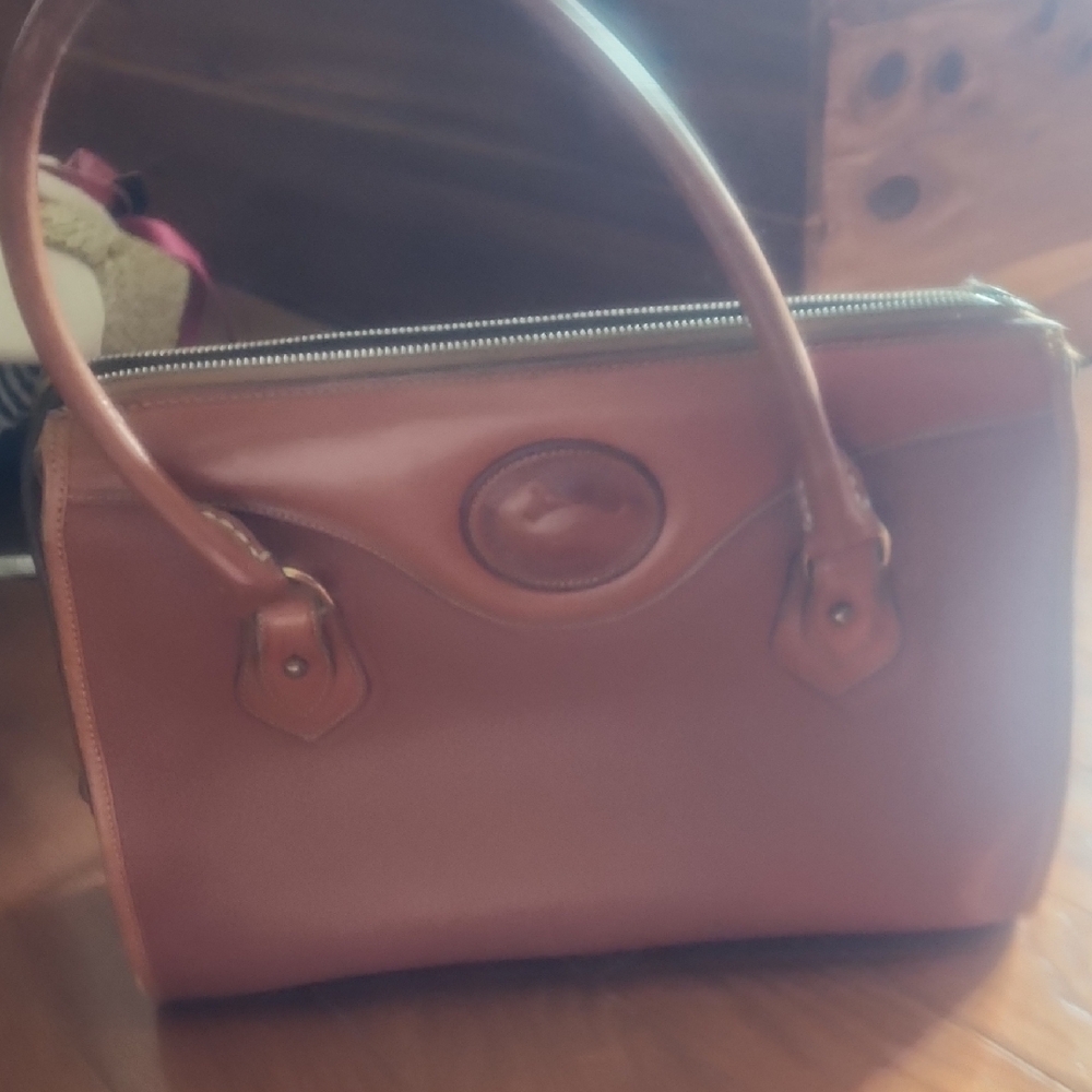 Dooney & Bourke Brown Satchel with Elegant Silhouette